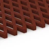 Großaufnahme vom Verbindungssystem von WARCO-Boden 7010 - Griglia antitrauma prato im Farbdesign Rosso mattone. Abmessungen 100 x 100 x 4 cm.